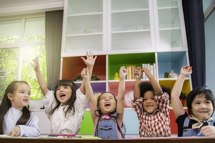 Children celebrating with their arms in the air