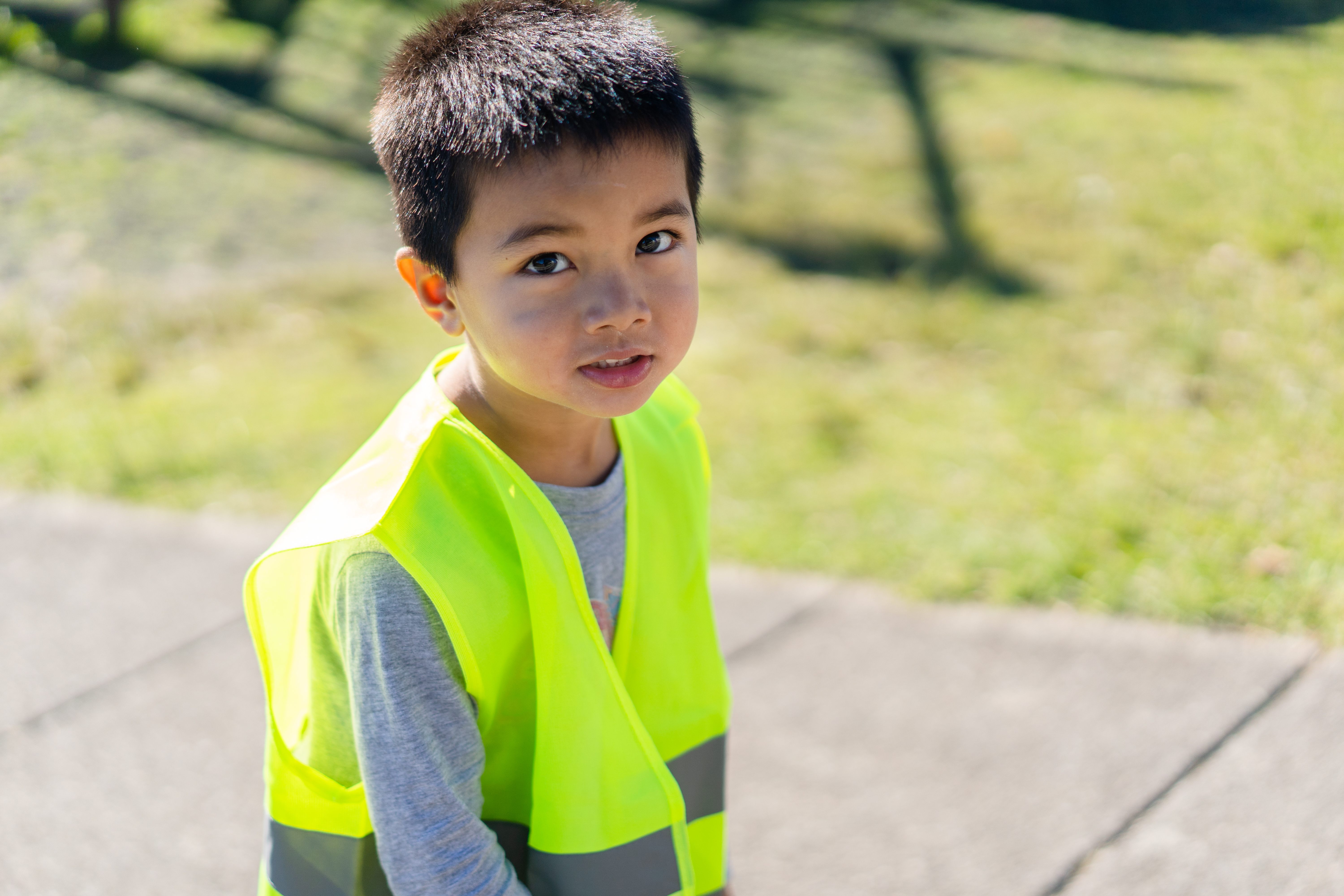 Young child wearing reflective vest
