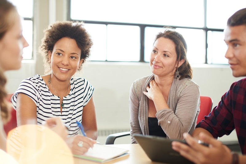 Educators at a team meeting having a productive conversation together