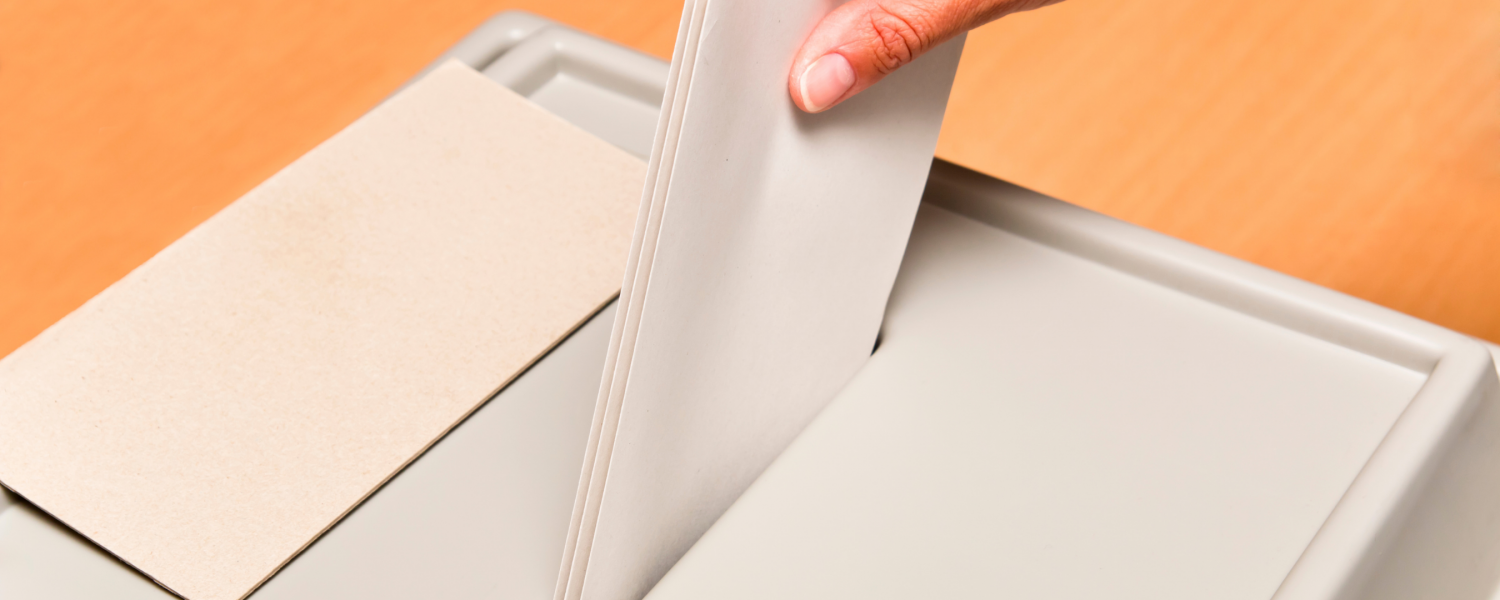 Envelope being placed in election ballot box