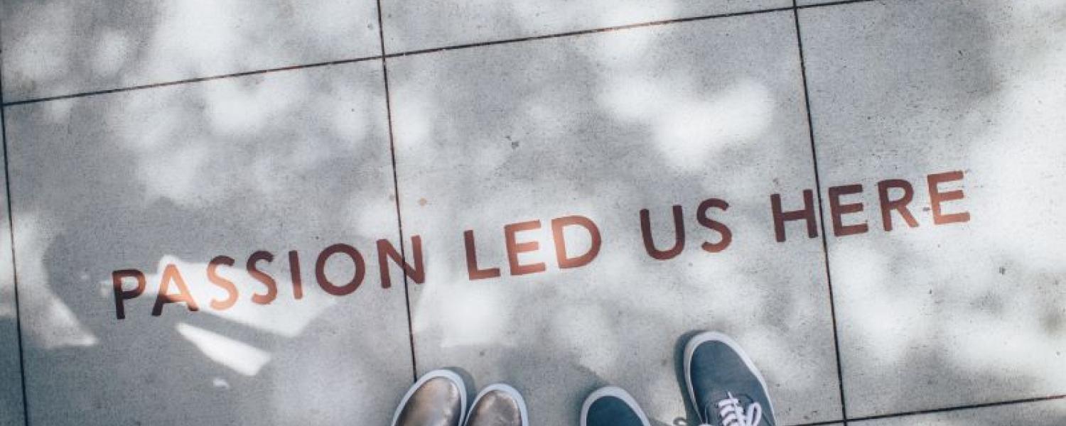 Passion led us here written on the footpath