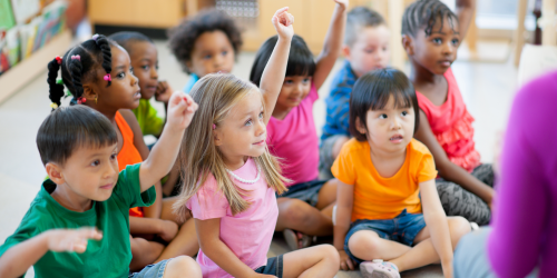 kindergarten children sitting on floor