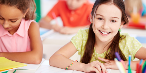 Preschool children sitting at desks