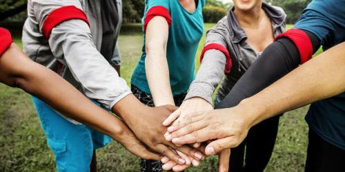 Group of educators stacking hands