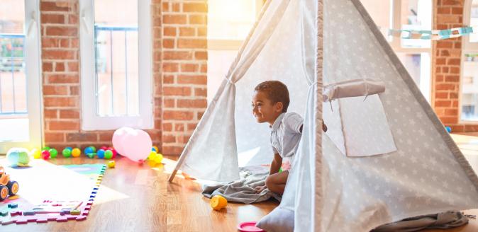 Child inside a tepee