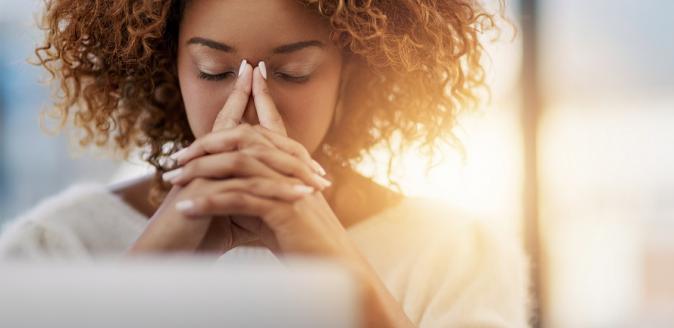 Woman with eyes closed, contemplating her next move