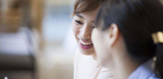 Two women from a non-English speaking background, engaged in conversation