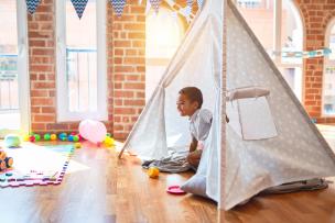 Child inside a tepee