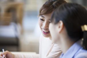 Two women from a non-English speaking background, engaged in conversation