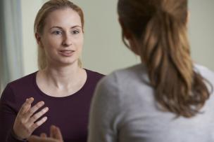 Two educators having a conversation together