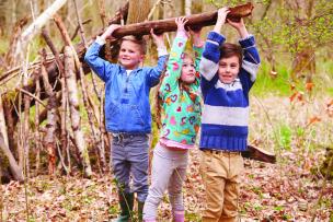 Children playing under a tree