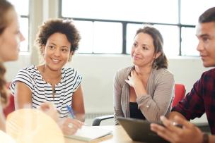 Educators at a team meeting having a productive conversation together
